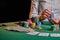 The croupier at the gaming table in the casino, raises bets with chips. Gaming business black jack, poker. With space for design