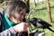 A crow tamer and his crow on a bench