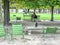 Crow watches couple taking selfie in the Tuileries Garden, Paris