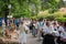 A crowd of artisans marches down the street