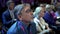 Crowd audience forum listen speaker. Auditorium viewer group business men.