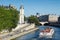 Crowd and boat on the banks of river Seine