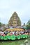 Crowd of Buddhists are offering incense to Buddha with thousand hands and thousand eyes in the Suoi Tien park in Saigon