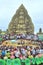 Crowd of Buddhists are offering incense to Buddha with thousand hands and thousand eyes in the Suoi Tien park in Saigon