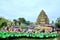 Crowd of Buddhists are offering incense to Buddha with thousand hands and thousand eyes in the Suoi Tien park in Saigon