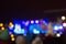 Crowd with children rest during show outdoor at night