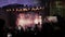 Crowd at concert - summer music festival. Concert crowd attending a concert, people silhouettes are visible, backlit by