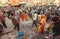 Crowd of different people rushing on street of Indian city