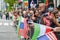 Crowd with Iranian and American flags is watching the annual Persian day Parade along Fifth Avenue