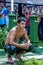 The crowd looks on as a wrestler relaxes after competing at the Kirkpinar Turkish Oil Wrestling Festival in Edirne in Turkey.