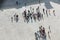 Crowd of people in center of town, top view. Tourists traveling