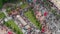 Crowd of people on a city street, top view, horizontal flight over the roofs bright houses: Gomel, Belarus - 05/09/2019