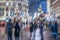 Crowd of people on city streets, Christmas holidays, abstract blurred background. Evening, neon lights, Christmas tree