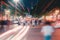 crowd of people crossing road in traffic, crossing the street. motion blur, dramatic urban scene