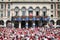 Crowd of people dressed in white and red cheering King Leon on the balcony at the Summer festival of Bayonne (Fetes de Bayonne),