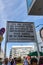 Crowd of people at information sign at Checkpoint Charlie in summer