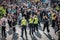 Crowd of people and  police women at entrance to myfest celebration on labor day in Berlin, Kreuzebrg