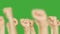 Crowd people raising up clenched fist up on green chroma key background. Men moving up hand fists isolated on chroma key