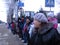 A crowd of people waiting in Novosibirsk, a motorcade of important officials