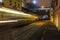 Crowd of people walking along tramway and train railings