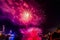 crowd of people watch the city's nighttime fireworks