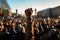 Crowd of people watching the concert at the open air. A raised fist of a protestor at a political demonstration, AI Generated