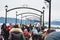 A crowd of people at White Rock looking at the natural phenomena of thousands of dead anchovies being eaten by wildlife.