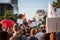 Crowd raising and holding rainbow gay flags during the Belgrade Gay Pride.