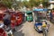 Crowd of rickshaw taxi, most part electric car on square