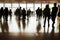 Crowd silhouettes at main entrance of convention center