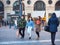 Crowd of teenagers walking downtown wearing protective masks during pandemic alert