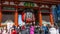Crowd of tourists by giant red lantern in Kaminarimon Gate of Senso-ji Temple in Asakusa area. It is also known as Thunder Gate