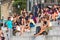 Crowd of tourists sit on the National Palace stairs in Barcelona