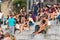 Crowd of tourists sit on the National Palace stairs in Barcelona