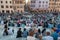 Crowd of tourists sitting on Spanish Steps popular Rome landmark