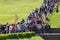 Crowd of tourists at the waterfall stairs of the Grand Cascade in the park of Peterhof, Russia