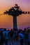 Crowd under the `Tree of Republic` monument in sunset in Izmir