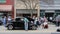 A crowd walks among the classic cars on display at an outdoor show in downtown Monroe, Georgia.