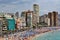 Crowded beach of Benidorm on a cloudy day