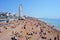 Crowded Brighton Beach with Brighton wheel.