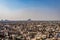 Crowded city construction with flat hazy sky at morning from unique angle