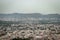 crowded city houses landscape with misty mountain background at morning from flat angle