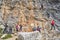 Crowded at the difficult start on via ferrata Cezare Piazzetta in Sella group, Dolomites mountains, Italy