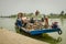 Crowded ferry transports people along the Thu BÃ²n River in Vietnam