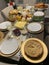 Crowded Full Table of Thanksgiving Food Ready for Serving for Dinner