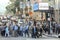 A crowded group of pedestrians crossing the green light on Vine street is one of the busiest streets in America