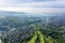 Crowded houses and golf course on misty morning