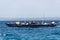 A crowded local fishing boat sailing in the Indian ocean, Tanzania, Africa