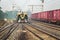 Crowded local passenger train of the Indian railways about to enter a railway station