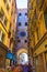 Crowded main street Clock tower archway Venice Italy
